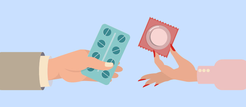 two forms of contraceptives in hand. Ills and condom
